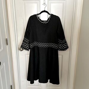 Gray sweater dress—white designs 
80% Rayon
20%Polyester
Hand wash